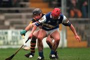 11 February 2001; DJ Carey of Kilkenny in action against Joe Phelan of Laois during the Allianz GAA National Hurling League Division 1B Round 2 match between Kilkenny and Laois at Nowlan Park in Kikenny. Photo by David Maher/Sportsfile