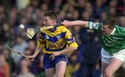 19 April 2001; Jamesie O'Connor of Clare races clear of Mark Foley of Limerick during the Allianz GAA National Hurling League Division 1A Round 5 match between Limerick and Clare at the Gaelic Grounds in Limerick. Photo by Ray McManus/Sportsfile