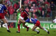 21 April 2001; Ronan O'Gara of Munster is tackled by Cliff Mytton of Stade Francais during the Heineken European Cup Semi-Final match between Stade Francais and Munster at Stadium Lille Metropole in Lille, France. Photo by Matt Browne/Sportsfile