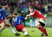 21 April 2001; Jason Holand of Munster is tackled by Diego Dominguez, 10, and Richard Pool-Jones of Stade Francais during the Heineken European Cup Semi-Final match between Stade Francais and Munster at Stadium Lille Metropole in Lille, France. Photo by Brendan Moran/Sportsfile