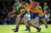 22 April 2001; Trevor Mortimer of Mayo is challenged by Francie Grehan and John Whyte, right, of Roscommon during the Allianz National Football League Semi Final match between Mayo and Roscommon at Markievicz Park in Sligo. Photo by Damien Eagers/Sportsfile