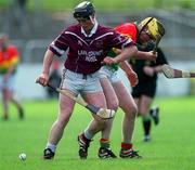 15 April 2001; Darren McCormack of Westmeath in action against Damien Roberts of Carlow during the Leinster Senior Hurling Championship First Preliminary Round match between Carlow and Westmeath at Dr Cullen Park in Carlow. Photo by Aoife Rice/Sportsfile