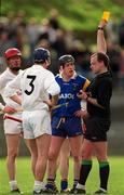 15 April 2001; Referee Michael Carroll shows the yellow card to Stuart Gleeson of Kildare during the Leinster Senior Hurling Championship First Preliminary Round match between Wicklow and Kildare at Pearse Park in Arklow, Wicklow. Photo by Ray McManus/Sportsfile