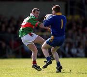 22 April 2001; Roscommon goalkeeper Shane Curran is tackled by Marty McNicholas of Mayo during the Allianz National Football League Semi Final match between Mayo and Roscommon at Markievicz Park in Sligo. Photo by Damien Eagers/Sportsfile