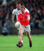 22 April 2001; Aidan Dorgan of Cork in action against Ronan Sweeney of Kildare during the Allianz GAA National Football League Division 2 Semi-Final match between Cork and Kildare at McDonagh Park in Nenagh, Tipperary. Photo by Ray McManus/Sportsfile