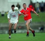 22 April 2001; Dermot Earley of Kildare in action against Nicholas Murphy of Cork during the Allianz GAA National Football League Division 2 Semi-Final match between Cork and Kildare at McDonagh Park in Nenagh, Tipperary. Photo by Ray McManus/Sportsfile