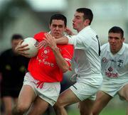 22 April 2001; Martin Cronin of Cork is tackled by Padraig Brennan of Kildare during the Allianz GAA National Football League Division 2 Semi-Final match between Cork and Kildare at McDonagh Park in Nenagh, Tipperary. Photo by Ray McManus/Sportsfile