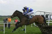 26 April 2001; Hot Stuff, with Barry Geraghty up, jump the last, to win the Weatherbys Hurdle from Cantiam, with Danny Howard up, who finished third, at Fairyhouse Racecourse in Meath. Photo by Matt Browne/Sportsfile