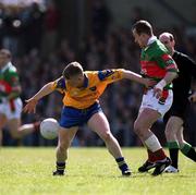22 April 2001; Ian Daly of Roscommon in action against Trevor Mortimer of Mayo during the Allianz National Football League Semi Final match between Mayo and Roscommon at Markievicz Park in Sligo. Photo by Damien Eagers/Sportsfile