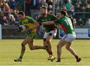 28 February 2016; Rory Kavanagh, Donegal, in action against Jason Gibbons and Diarmuid O'Connor, Mayo. Allianz Football League, Division 1, Round 3, Donegal v Mayo, MacCumhaill Park, Ballybofey, Co. Donegal. Picture credit: Oliver McVeigh / SPORTSFILE