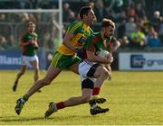 28 February 2016; Jason Gibbons, Mayo, in action against Rory Kavanagh, Donegal. Allianz Football League, Division 1, Round 3, Donegal v Mayo, MacCumhaill Park, Ballybofey, Co. Donegal. Picture credit: Oliver McVeigh / SPORTSFILE