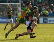 28 February 2016; Jason Gibbons, Mayo, in action against Rory Kavanagh, Donegal. Allianz Football League, Division 1, Round 3, Donegal v Mayo, MacCumhaill Park, Ballybofey, Co. Donegal. Picture credit: Oliver McVeigh / SPORTSFILE