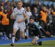 28 February 2016;Rory Scholes, Ulster, breaks free from  Aled Summerhilll, Cardiff. Guinness PRO12 Round 16, Cardiff Blues v Ulster, BT Sport Cardiff Arms Park, Cardiff, Wales. Picture credit: Gareth Everett / SPORTSFILE