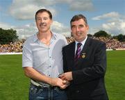 19 July 2009; Tyrone1984 Jubilee Team member Kevin McCabe receives a presentation from Ulster GAA President Tom Daly, right, at half time in the GAA Football Ulster Senior Championship Final, Tyrone v Antrim, St Tighearnach's Park, Clones, Co. Monaghan. Picture credit: Oliver McVeigh / SPORTSFILE