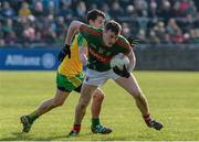 28 February 2016; Diarmuid O'Connor, Mayo, in action against Eoin McHugh, Donegal. Allianz Football League, Division 1, Round 3, Donegal v Mayo, MacCumhaill Park, Ballybofey, Co. Donegal. Picture credit: Oliver McVeigh / SPORTSFILE