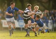 10 February 2010; Philip O'Dwyer, CC Roscrea, is tackled by Jerry Sexton, left, Conor Hogan and Maurice Walsh, right, St Mary's College. Leinster Schools Senior Cup Quarter-Final, CC Roscrea v St Mary's College, Lakelands Park, Terenure, Dublin. Picture credit: Stephen McCarthy / SPORTSFILE