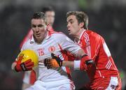 6 February 2010; Tommy McGuigan, Tyrone, in action against Brian Og McAlary, Derry.. Allianz GAA Football National League, Division 1, Round 1, Derry v Tyrone, Celtic Park, Derry. Picture credit: Oliver McVeigh / SPORTSFILE