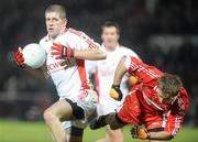 6 February 2010; Kevin Hughes, Tyrone, in action against Brian Og McAlary, Derry. Allianz GAA Football National League, Division 1, Round 1, Derry v Tyrone, Celtic Park, Derry. Picture credit: Oliver McVeigh / SPORTSFILE