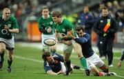 13 February 2010; Gordon D'Arcy, Ireland, loses possession after being tackled by David Marty, France. RBS Six Nations Rugby Championship, France v Ireland, Stade de France, Saint Denis, Paris, France. Picture credit: Brendan Moran / SPORTSFILE