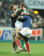 13 February 2010; Tommy Bowe, Ireland, is tackled by Lionel Nallet, left, and Mathieu Bastareaud, France. RBS Six Nations Rugby Championship, France v Ireland, Stade de France, Saint Denis, Paris, France. Picture credit: Brendan Moran / SPORTSFILE