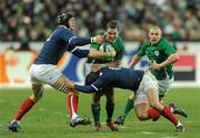 13 February 2010; Paddy Wallace, supported by Keith Earls, right, Ireland, is tackled by Julien Bonnaire, left, and Francois Trinh-Duc, France. RBS Six Nations Rugby Championship, France v Ireland, Stade de France, Saint Denis, Paris, France. Picture credit: Brian Lawless / SPORTSFILE