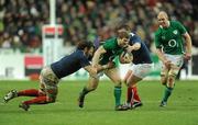 13 February 2010; Gordon D'Arcy, supported by Paul O'Connell, Ireland, is tackled by Lionel Nallet, left, and Thomas Domingo, France. RBS Six Nations Rugby Championship, France v Ireland, Stade de France, Saint Denis, Paris, France. Picture credit: Brian Lawless / SPORTSFILE