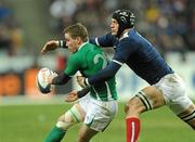 13 February 2010; Eoin Reddan, Ireland, is tackled by Julien Bonnaire, France. RBS Six Nations Rugby Championship, France v Ireland, Stade de France, Saint Denis, Paris, France. Picture credit: Brian Lawless / SPORTSFILE *** Local Caption ***