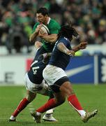 13 February 2010; Rob Kearney, Ireland, is tackled by Vincent Clerc, left, and Mathieu Bastareaud, France. RBS Six Nations Rugby Championship, France v Ireland, Stade de France, Saint Denis, Paris, France. Picture credit: Brian Lawless / SPORTSFILE