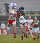 14 February 2010; Kevin McLoughlin, Mayo, in action against Com Cavanagh, Tyrone. Allianz National Football League, Division 1, Round 2, Tyrone v Mayo, Healy Park, Omagh, Co. Tyrone. Picture credit: Oliver McVeigh / SPORTSFILE