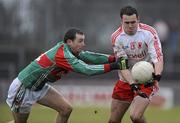 14 February 2010; Kyle Coney, Tyrone, in action against Keith Higgins, Mayo. Allianz National Football League, Division 1, Round 2, Tyrone v Mayo, Healy Park, Omagh, Co. Tyrone. Picture credit: Oliver McVeigh / SPORTSFILE