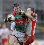 14 February 2010; Ronan McGarrity, Mayo, in action against Aidan Cassidy, Tyrone. Allianz National Football League, Division 1, Round 2, Tyrone v Mayo, Healy Park, Omagh, Co. Tyrone. Picture credit: Oliver McVeigh / SPORTSFILE