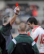 14 February 2010; Referee Jimmy White issues a red card to Joe McMahon, Tyrone, after a late incident. Allianz National Football League, Division 1, Round 2, Tyrone v Mayo, Healy Park, Omagh, Co. Tyrone. Picture credit: Oliver McVeigh / SPORTSFILE