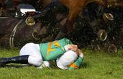 29 April 2003; Jockey Kevin Power on the ground with horses falling all around after the pile up during the Bewleys Hotel And European Breeders Fund national Hunt Fillies Championship Bumper in front of the main stand at Punchestown, Co. Kildare. Horse Racing. Picture credit; Matt Browne / SPORTSFILE