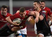 5 March 2016; Andrew Conway, Munster, is tackled by Jason Tovey, left, and Phil Price, Newport Gwent Dragons. Guinness PRO12, Round 17, Munster v Newport Gwent Dragons, Thomond Park, Limerick. Picture credit: Brendan Moran / SPORTSFILE