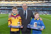 5 March 2016; Donal Bollard, from Allianz Ireland, makes a presentation to Josh Keeley, left, Scoil Chiaráin, Marino, and Callum Brady, St Joseph NS, Fairview, to mark their outstanding performance during the Allianz Cumann na mBunscol competitions at the Dublin v Cork game. Allianz Hurling League, Division 1A, Round 3, Dublin v Cork, Croke Park, Dublin. Picture credit: Ray McManus / SPORTSFILE