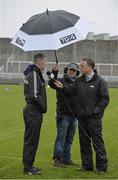 6 March 2016; TG4 Floor manager Odhrán Mac Murchadha holds an umbrella as Kerry manager Ciaran Carey is interviewed by Michéal O Domhnaill of TG4 before the game. Allianz Hurling League, Division 1B, Round 3, Kerry v Wexford. Austin Stack Park, Tralee, Co. Kerry. Picture credit: Brendan Moran / SPORTSFILE