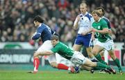 13 February 2010; Clement Piotrenaud, France, escapes the tackle of Gordon D'Arcy. RBS Six Nations Rugby Championship, France v Ireland, Stade de France, Saint Denis, Paris, France. Picture credit: Brendan Moran / SPORTSFILE *** Local Caption ***