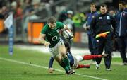 13 February 2010; Gordon D'Arcy, Ireland, escapes the tackle of Clement Piotrenaud, France. RBS Six Nations Rugby Championship, France v Ireland, Stade de France, Saint Denis, Paris, France. Picture credit: Brendan Moran / SPORTSFILE *** Local Caption ***