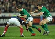 13 February 2010; Paddy Wallace, supported by David Wallace, right, Ireland, is tackled by Francois Trinh-Duc, France. RBS Six Nations Rugby Championship, France v Ireland, Stade de France, Saint Denis, Paris, France. Picture credit: Brian Lawless / SPORTSFILE *** Local Caption ***