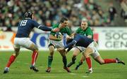 13 February 2010; Paddy Wallace, supported by Keith Earls, right, Ireland, is tackled by Julien Bonnaire, left, and Francois Trinh-Duc, France. RBS Six Nations Rugby Championship, France v Ireland, Stade de France, Saint Denis, Paris, France. Picture credit: Brian Lawless / SPORTSFILE *** Local Caption ***