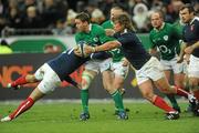 13 February 2010; Eoin Reddan, Ireland, is tackled by David Marty, left, and Dimitri Szarzewski, France. RBS Six Nations Rugby Championship, France v Ireland, Stade de France, Saint Denis, Paris, France. Picture credit: Brian Lawless / SPORTSFILE *** Local Caption ***