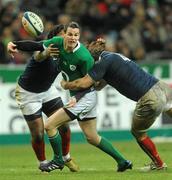 13 February 2010; Jonathan Sexton, Ireland, is tackled by Mathieu Bastareaud, left, and Lionel Nallet, France. RBS Six Nations Rugby Championship, France v Ireland, Stade de France, Saint Denis, Paris, France. Picture credit: Brian Lawless / SPORTSFILE *** Local Caption ***