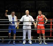 19 February 2010; Michael Staples, Drimnagh, is victorious over Paul Quinn, All Blacks, red, following their 57kg bout, with referee Paddy McDonagh, Mayo. National Mens and Womens Elite National Boxing Championships, Preliminary Rounds, National Stadium, Dublin. Picture credit: Stephen McCarthy / SPORTSFILE