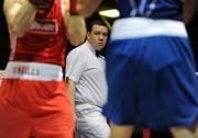19 February 2010; Referee James McCarron keeps a close eye on the 69kg bout between Ronan Brennan, Dealgan, red, and Shane Murtagh, Crumlin, blue. National Mens and Womens Elite National Boxing Championships, Preliminary Rounds, National Stadium, Dublin. Picture credit: Stephen McCarthy / SPORTSFILE