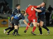 20 February 2010; Leinster players, from left, Fergus McFadden, Shaun Berne and Stephen Keogh tackle Jon Davies, Scarlets. Celtic League, Leinster v Scarlets. RDS, Dublin. Picture credit: Stephen McMahon / SPORTSFILE