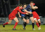 20 February 2010; Stephen Keogh, Leinster, is tackled by Rhys Priestland, left, and Daniel Evans, Scarlets. Celtic League, Leinster v Scarlets. RDS, Dublin. Picture credit: Stephen McCarthy / SPORTSFILE