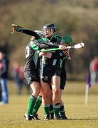 21 February 2010; The Queen's University goalkeeper Laura Quinn celebrates winning the Purcell Shield Final with team-mates Brenda Toner, left, and Anne McGuigan. Queen's University, Belfast, v National University of Ireland, Maynooth, pitch 3, Cork Institute of Technology, Cork. Picture credit: Ray McManus / SPORTSFILE