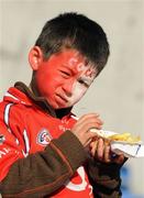21 February 2010; A young Cork supporter enjoys a carton of chips before the game. Allianz GAA Hurling National League Division 1 Round 1, Cork v Offaly. Pairc Ui Chaoimh, Cork. Picture credit: Ray McManus / SPORTSFILE