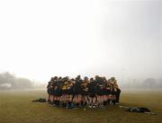 21 February 2010; NUI Maynooth players form a huddle prior to their clash with Queens under thick fog. Purcell Shield Final, Queens University, Belfast v National Unversity Ireland, Maynooth. Cork Institute of Technology, Cork. Picture credit: Stephen McCarthy / SPORTSFILE