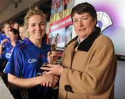 21 February 2010; Lynn Kelly, President of 3rd Level Camogie Association, presents Katrina Parrock, WIT, with her player of the match award. Ashbourne Cup Final Waterford Institute of Technology v University College Cork. Cork Institute of Technology, Cork. Picture credit: Stephen McCarthy / SPORTSFILE
